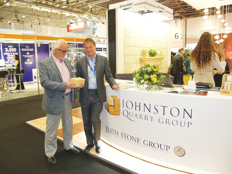 Bill Bolsover and Nicholas Johnstone look at a piece of Guiting stone