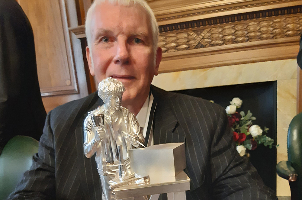 Master Martin Low with the statuette he donated Master Martin Low with the statuette he donated